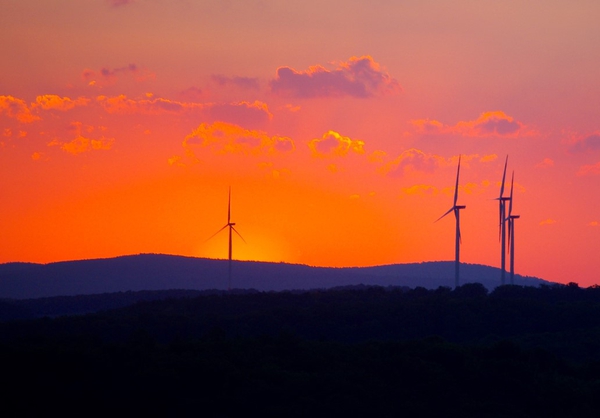 Sunset over turbines. Source: Gerhard Böpple / Flickr