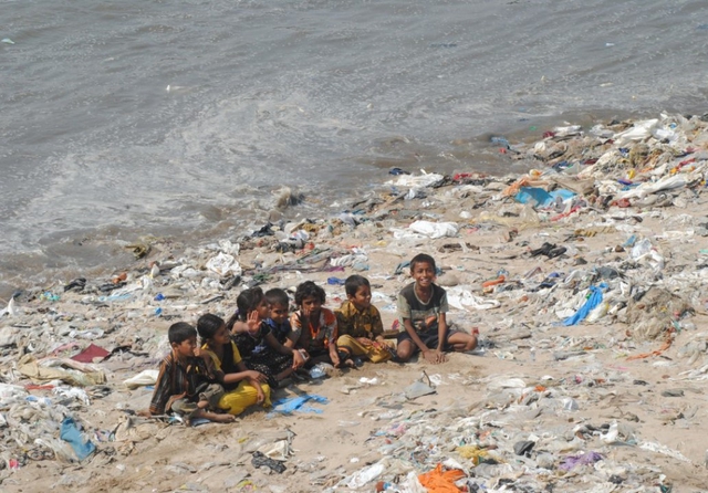 Plastic waste on the beach at Versova Creek, Mumbai, India