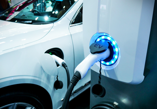 Electric vehicle charging. Credit: buffaloboy / Shutterstock