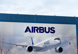 Airbus logo and plane. Credit: Manuel Esteban / Shutterstock