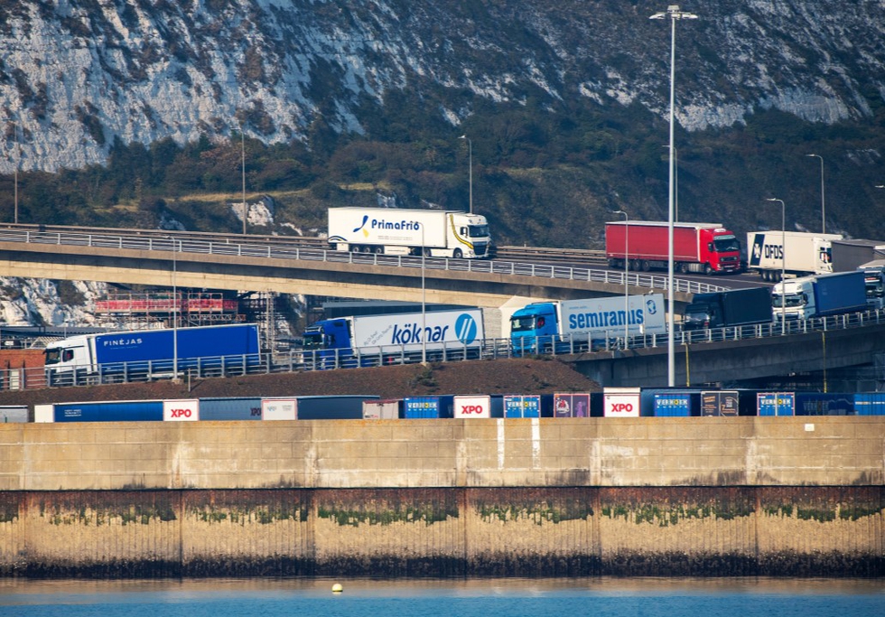 Dover, UK. 2020. Trucks queue on the A2 highway to enter the Port of Dover and a cross channel ferry to France. Credit: Peter Titmuss/Shutterstock