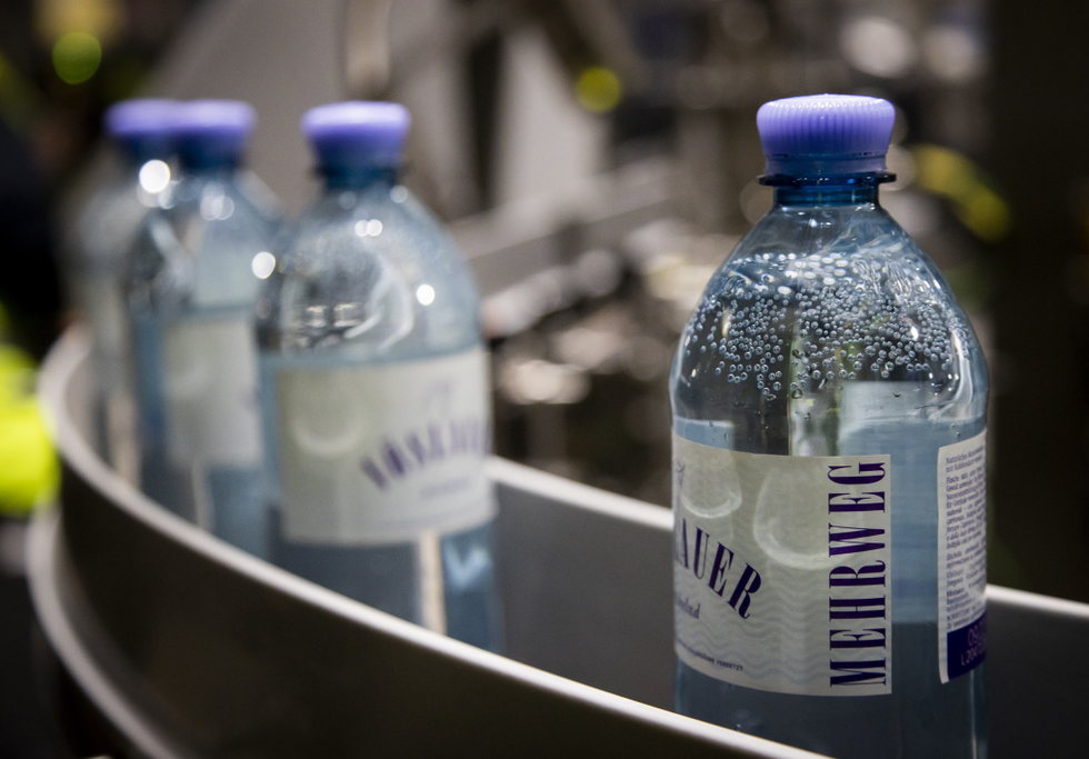 ALPLA, Vöslauer returnable plastic bottles in factory.png